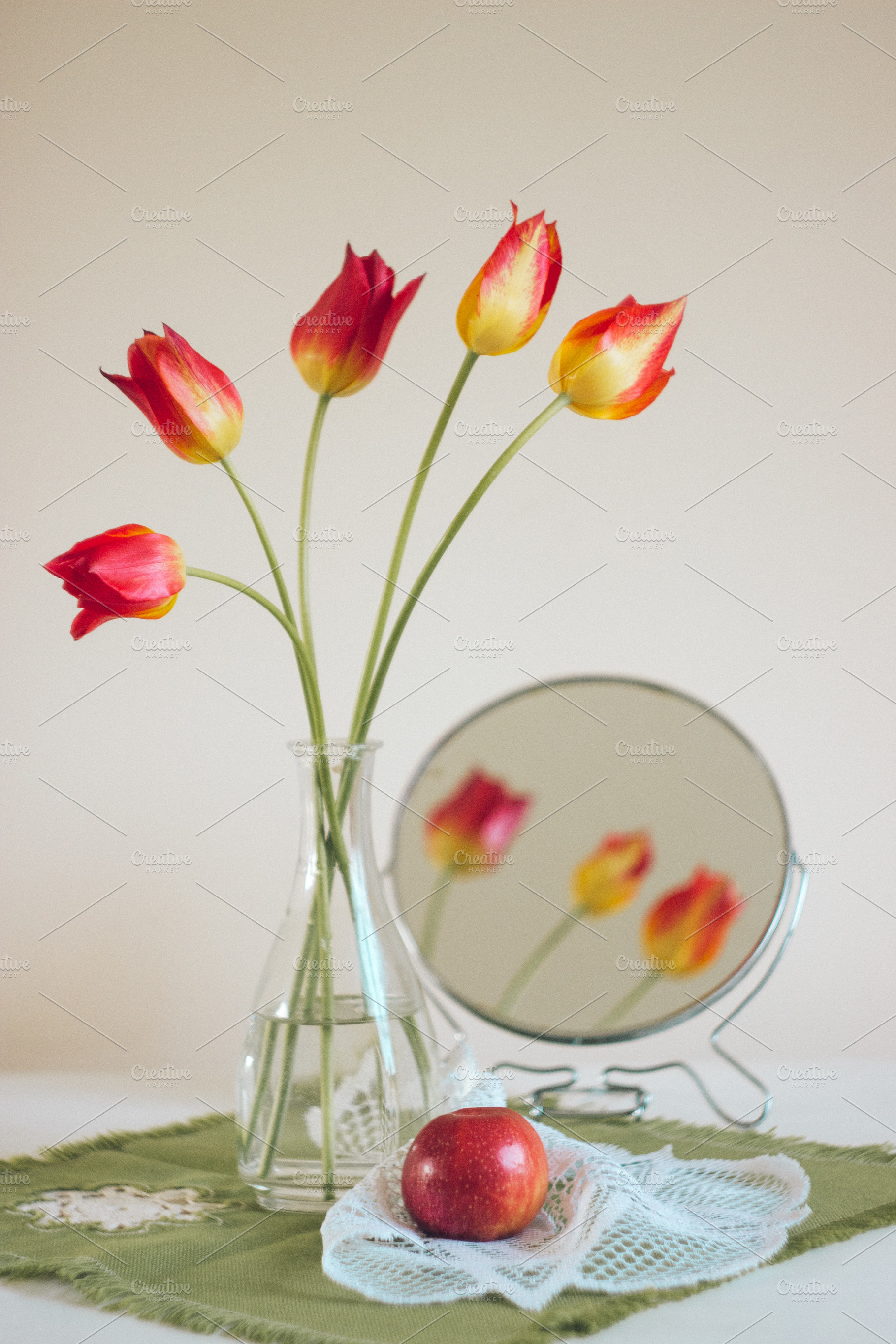 Red tulips in a glass vase featuring green, knitted napkin, and decoration, an Arts & Entertainment Photo by PSD templates and Photos