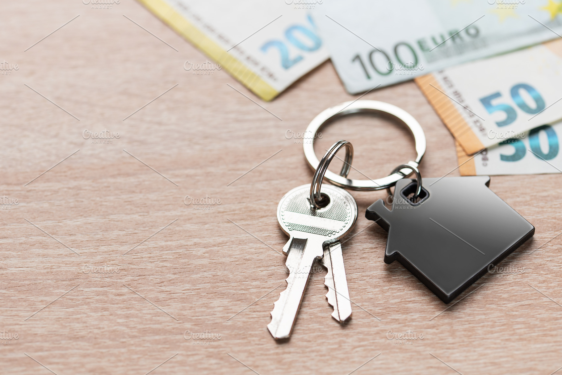House keys with home shape keyring and euro currency, a Business Photo by Olena Rudo