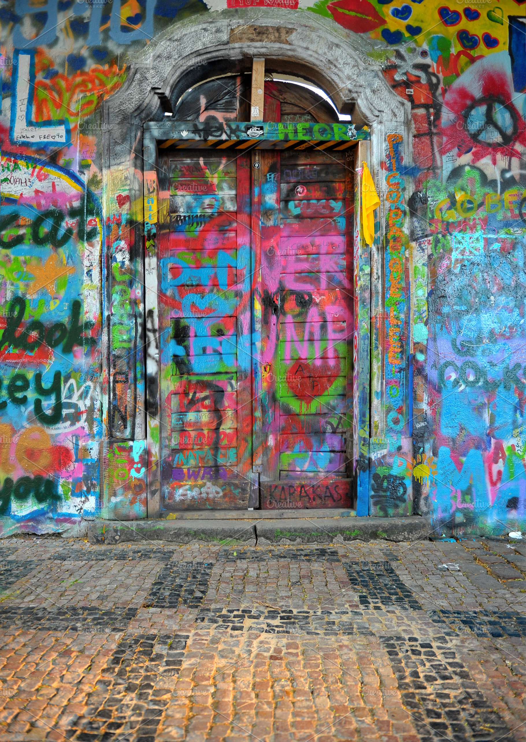 Old doorway covered in graffiti, an Arts & Entertainment Photo by Serifs & Whiskey