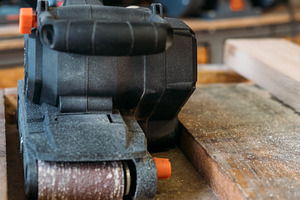 Carpentry equipment belt sander electric tool work, an Industrial Photo by Photo Drive Studio