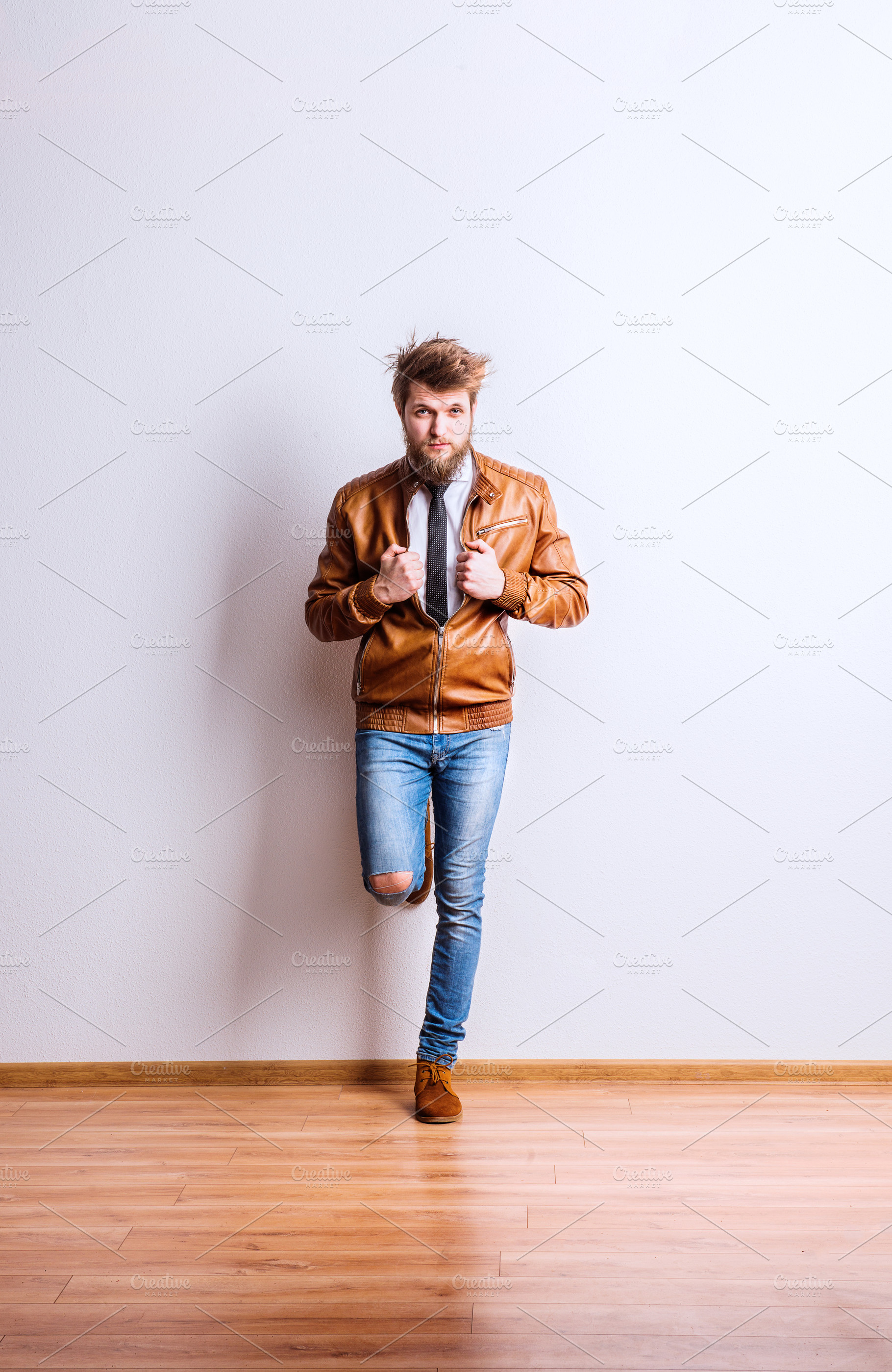 Portrait of a young hipster man in a studio copy space featuring studio, a Person Photo by HalfPoint