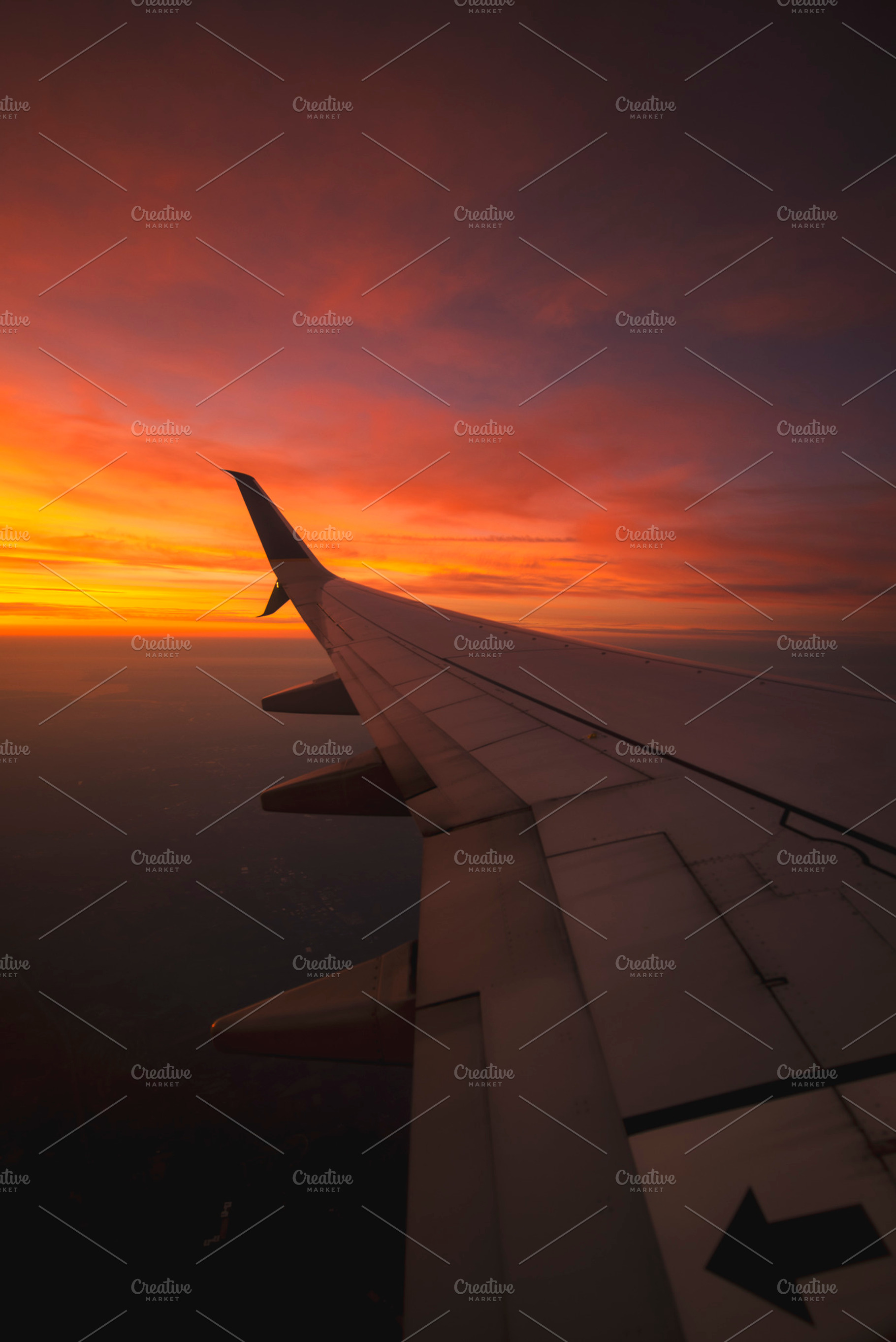 Sunset From Airplane Window, a Transportation Photo by NomadicA