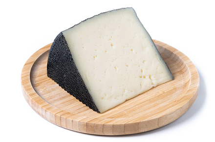 Close-up of a wedge of semi-cured cow's cheese