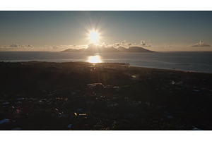 Sunrise illuminating Moorea island, a Nature Photo by Goinyk