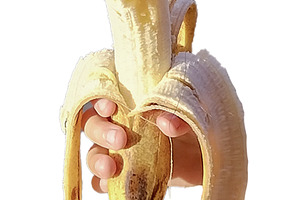 Hand holding banana isolated photo, a Food & Drink Photo by DanFLCreativo