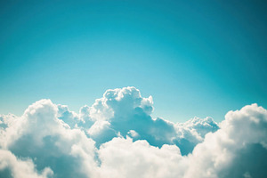 Fluffy clouds against blue sky, a Photo by Beautiful things