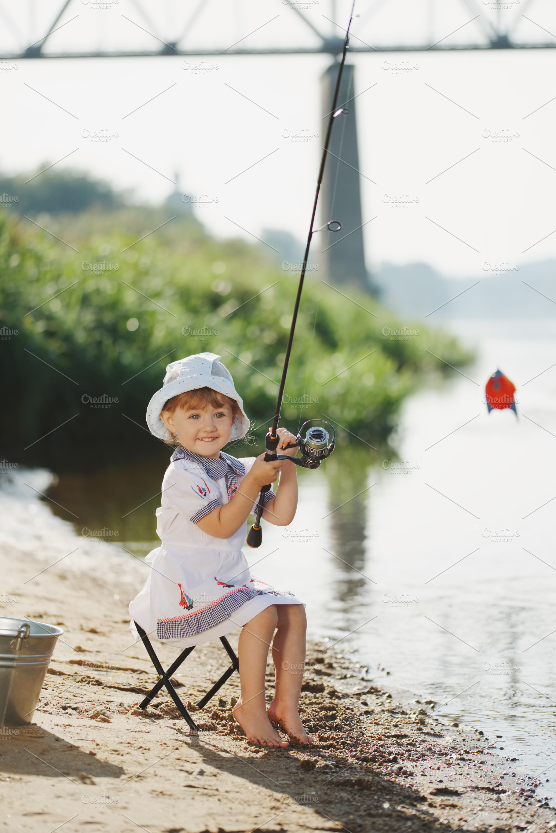 Happy girl with rod on coast of river containing fishing, girl, and little, a Nature Photo by AlohaHawaii