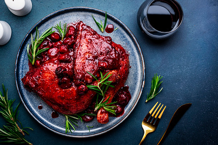 Baked duck legs in wine and cherry sauce with rosemary. Gourmet, a Food & Drink Photo by 5PH