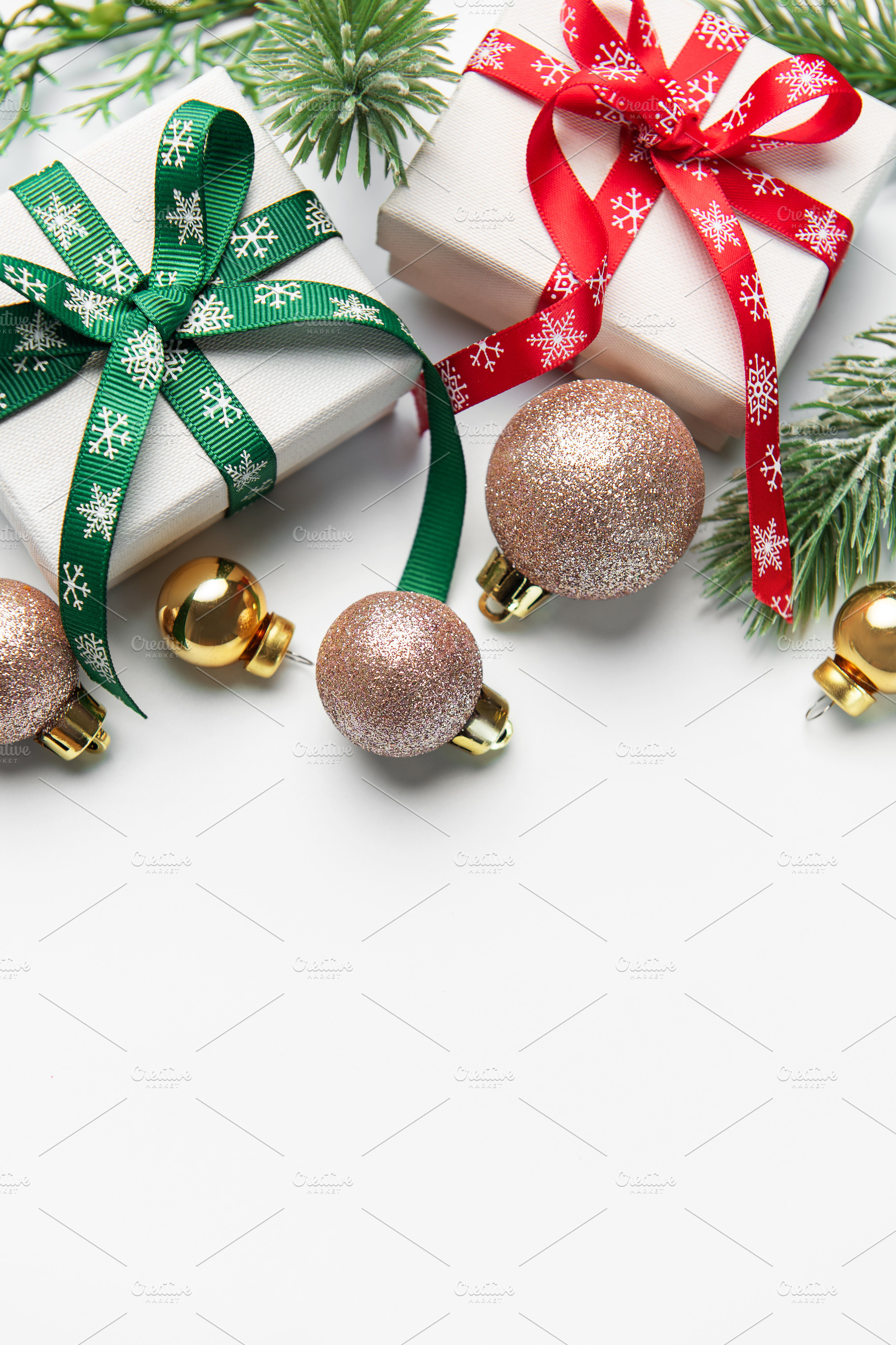 Christmas presents with festive ribbon and ornaments, a Holiday Photo by Olena Rudo