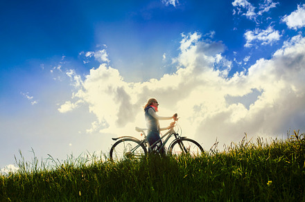 Girl with bike over sky, a Sports & Recreation Photo by Sergey Furtaev