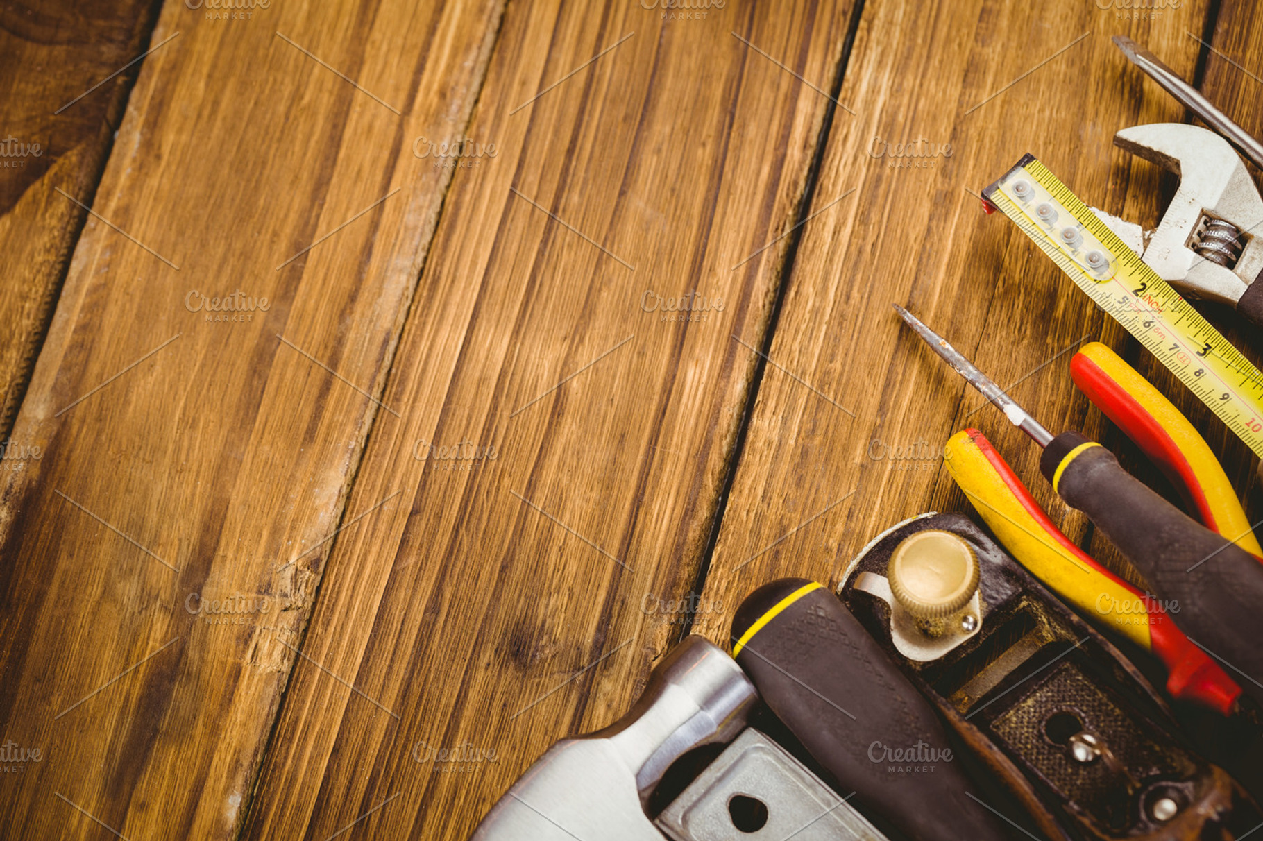 DIY tools laid out on table, a Photo by wavebreak | Creative Market