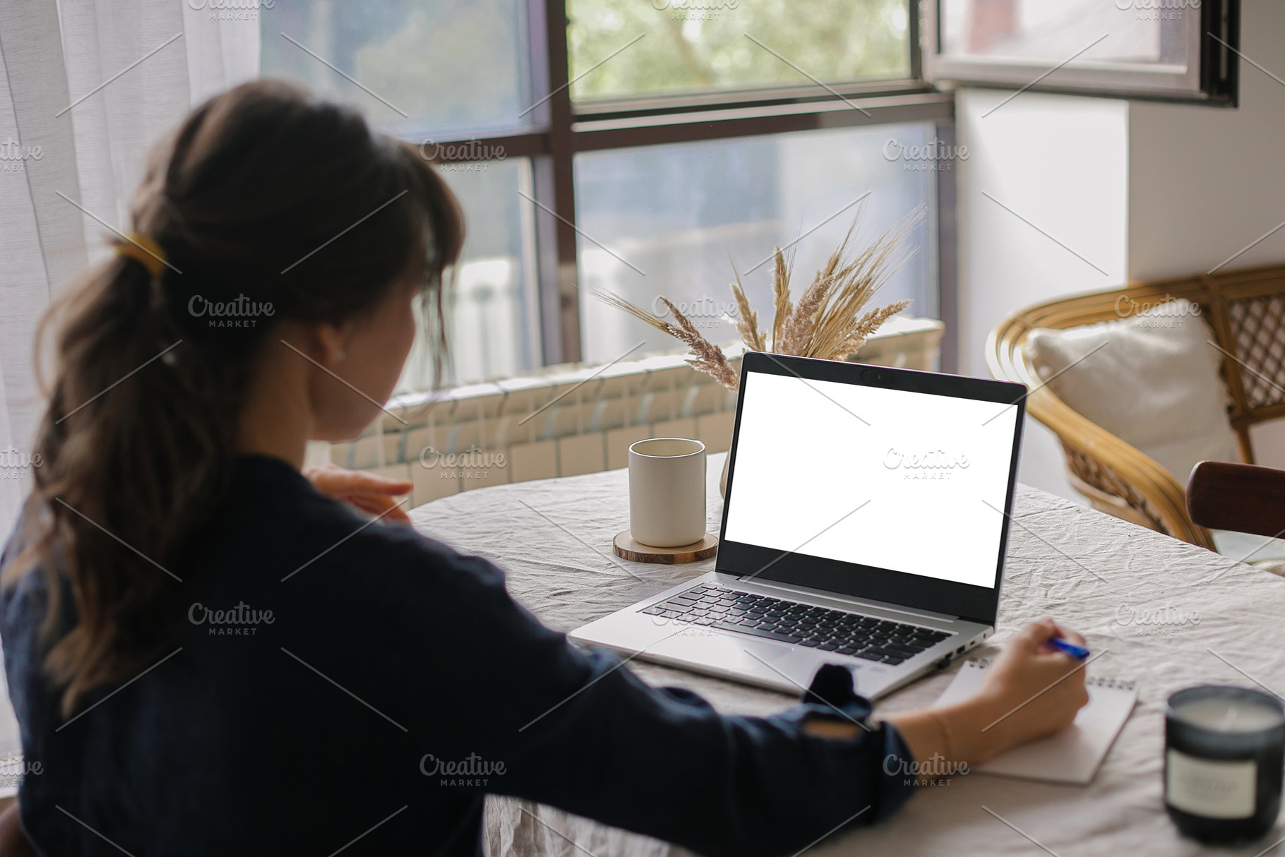 White screen on laptop. Mockup. Young woman working remotely on laptop computer, a Person Photo by Anikona