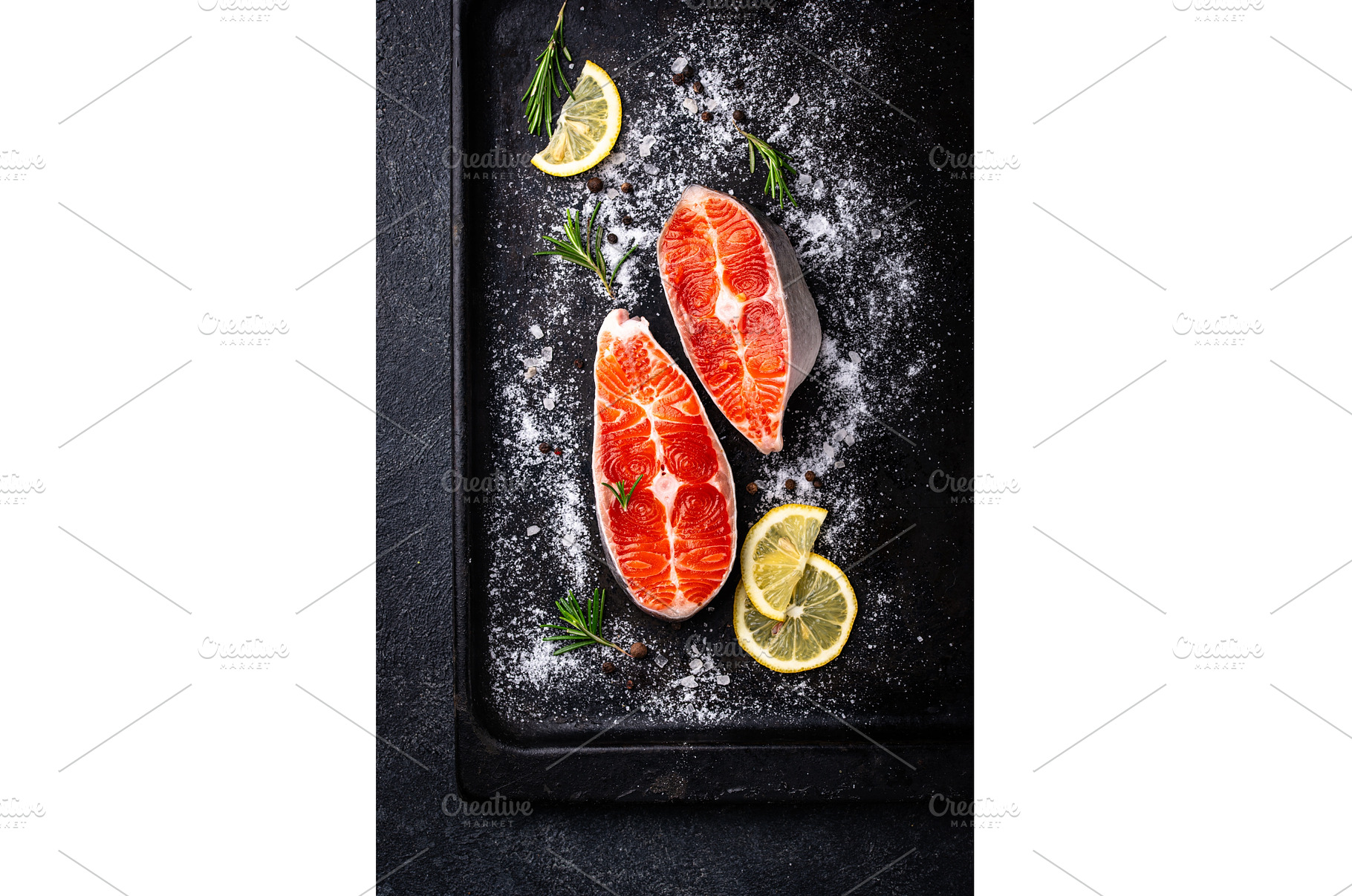 Raw uncooked salmon with rosemary, a Food & Drink Photo by Yulia Furman