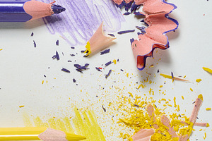 Purple and yellow pencils with colored shavings and drawn stroke, a School & Education Photo by ndanko