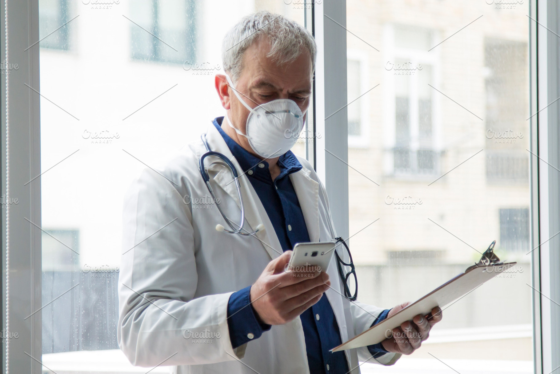 Doctor with mask using mobile phone containing coronavirus, health, and doctor, a Person Photo by tetxu