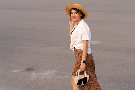 Cheerful woman with straw hat
