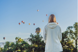 Female tourist standing with, a Holiday Photo by Elizaveta Galitskaya