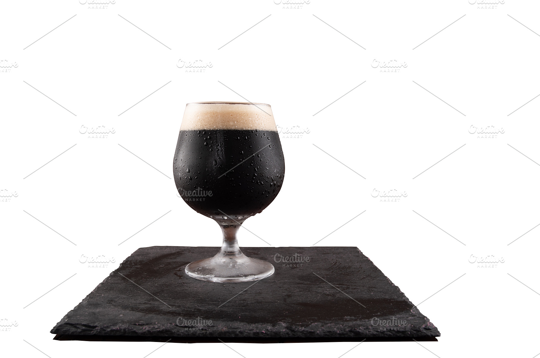 A glass of dark beer on a white, a Food & Drink Photo by Stockphoto by vzwer