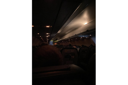 Inside cabin of airplane at night, a Transportation Photo by Media Whale Stock