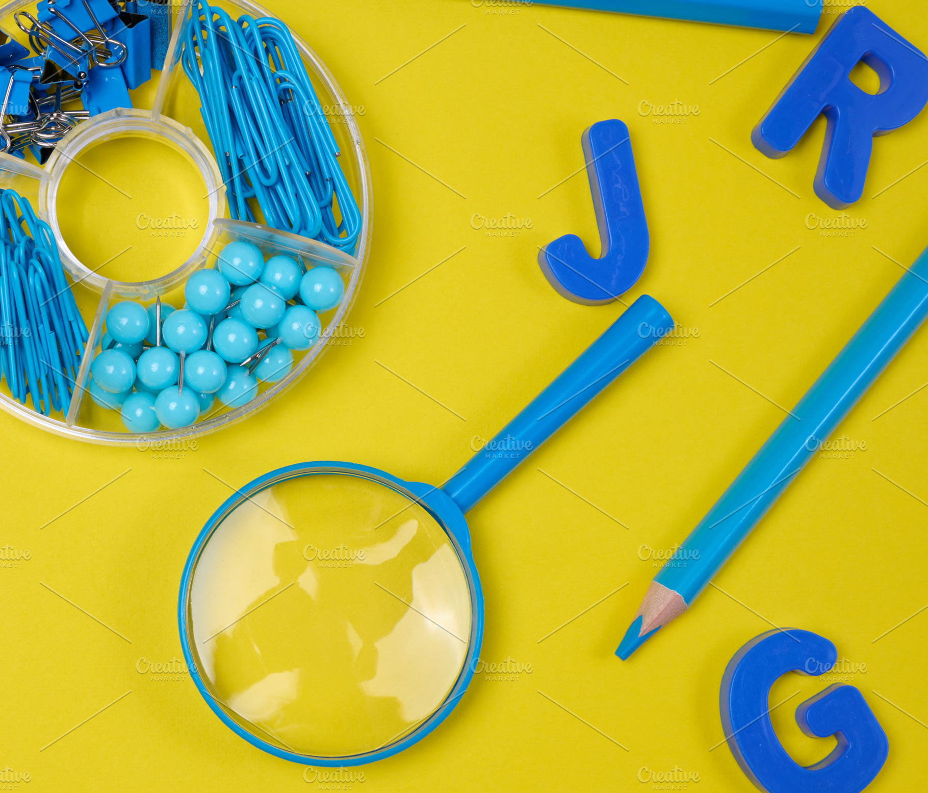 Assortment of blue stationery, letters, paper clips, and supplie, an Abstract Photo by ndanko