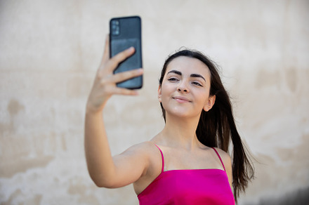 Portrait of beautiful dark-haired teenager woman wearing pink to, a Person Photo by José Manuel Gelpi