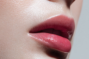 Woman's glossy pink lips and healthy skin showing beauty, makeup, a Beauty & Fashion Photo by Studio ANNA