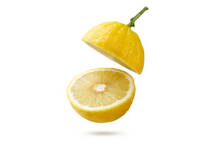 Two bergamot halves flying on a, a Food & Drink Photo by innakreativ