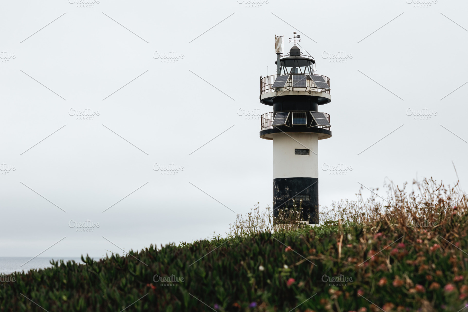 Modern black and white lighthouse on, an Architecture Photo by Perpis