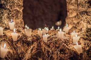 Votive candles glowing inside a