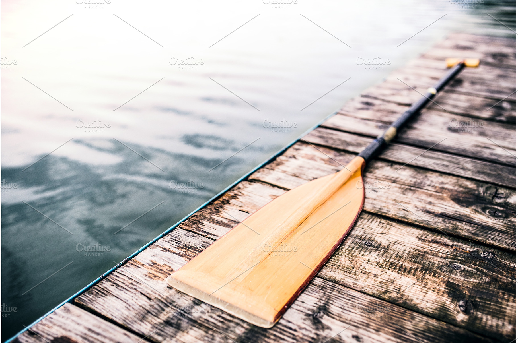 Paddle on wooden dock. Concept of, a Sports & Recreation Photo by HalfPoint