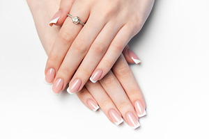 Woman showing french manicure and elegant ring on white backgrou, a Beauty & Fashion Photo by Olena Rudo