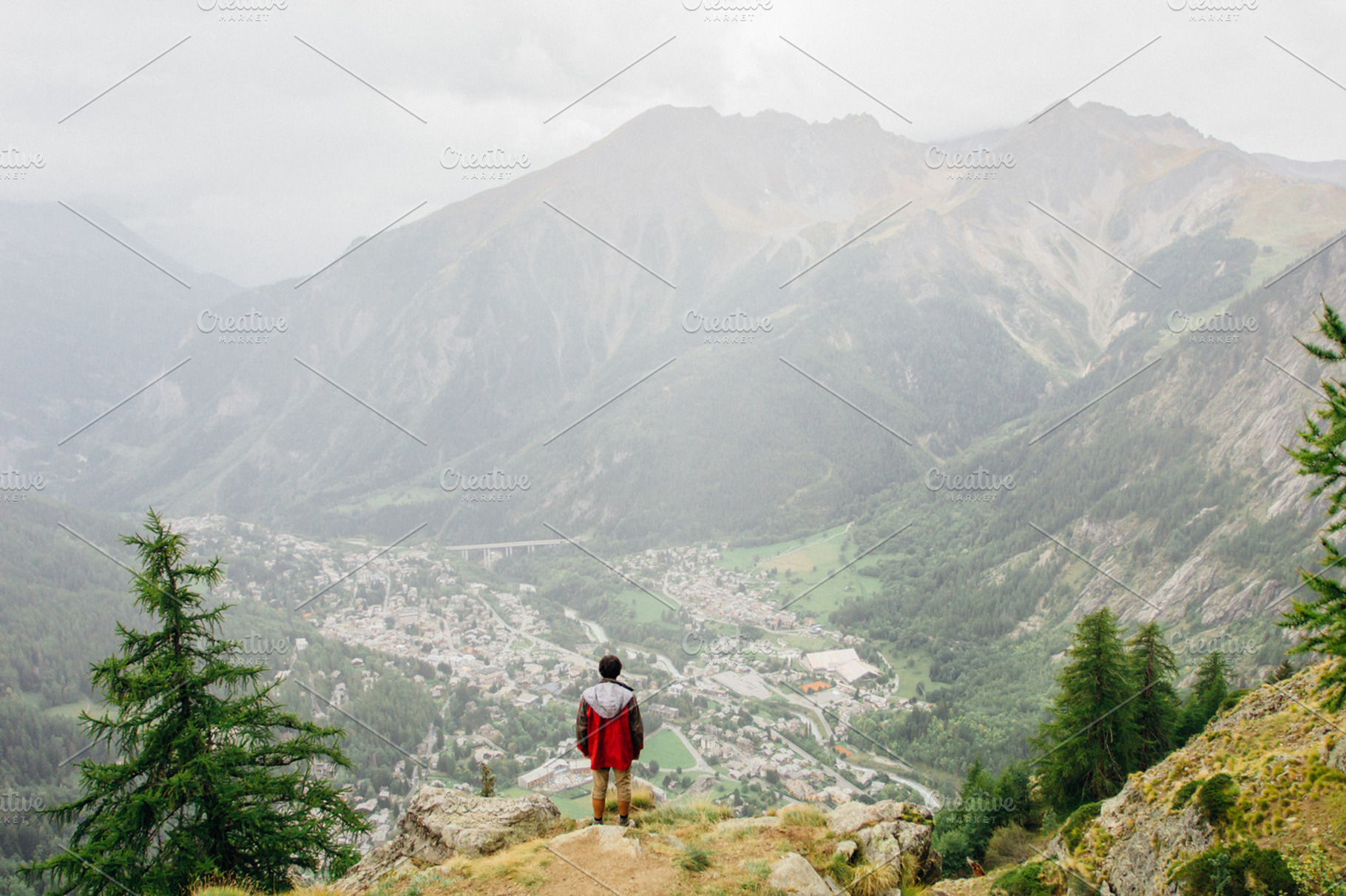 Hiker enjoys the view in the alps featuring mountain, view, and hike, a Holiday Photo by Mukuko Studio
