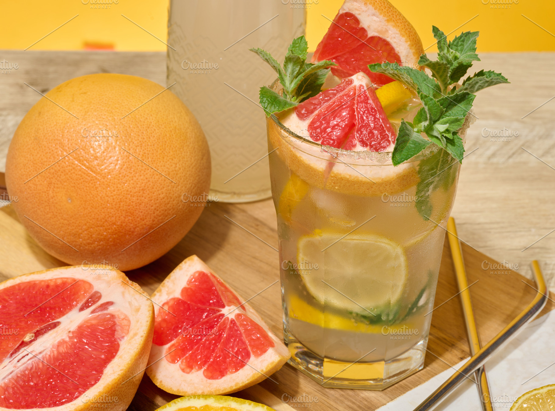 Glass with cool drink garnished with mint, lemon and grapefruit., a Food & Drink Photo by ndanko