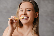 Healthy teeth and care. Happy lady brushing teeth with toothbrush and smiling a, a Photo by Prostock-Studio (Thumbnail 2 of 5)