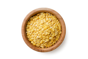 Raw lentils in a wooden plate on a, a Food & Drink Photo by innakreativ