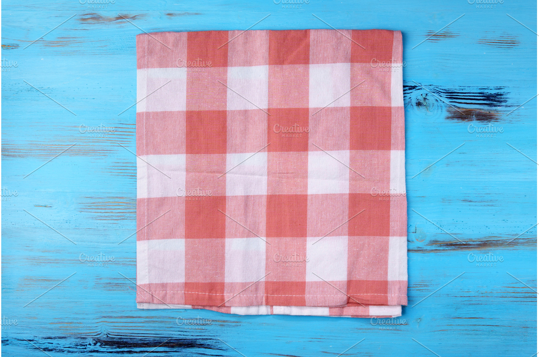 Empty red kitchen napkin on a blue, an Abstract Photo by darksoul72
