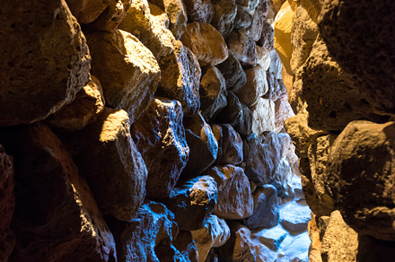Dark tunnel in stone cave, a Nature Photo by Vapi