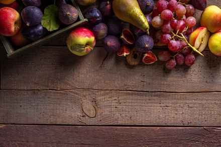 Autumn fruit assortment on wooden background, a Food & Drink Photo by Rimma
