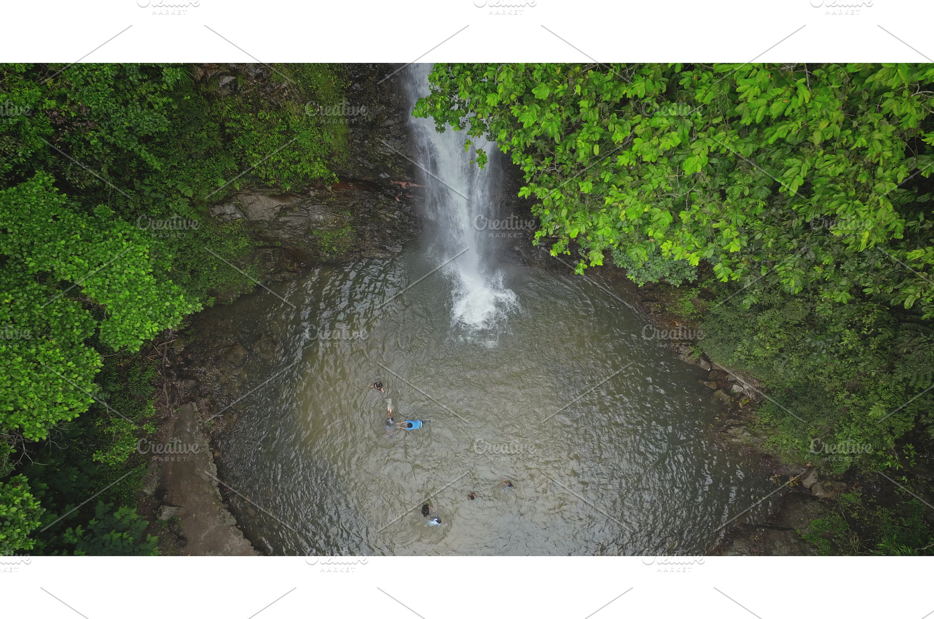 Tourists enjoying waterfall in, an Animal Photo by Goinyk