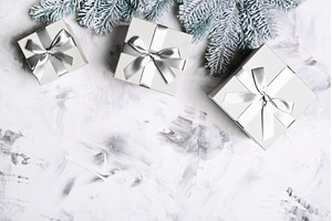 Gray gift boxes and frosted fir, a Holiday Photo by Anna Efetova