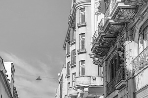 Historic city corner with ornate balconies, an Architecture Photo by DanFLCreativo
