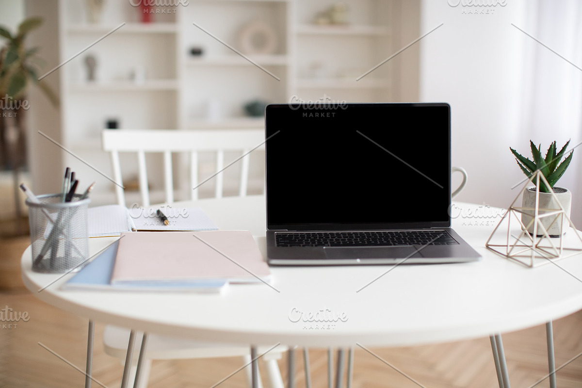 Laptop Computer With Empty Screen Standing On Table At Home, a Photo by Prostock-Studio (Photo 2 of 2)