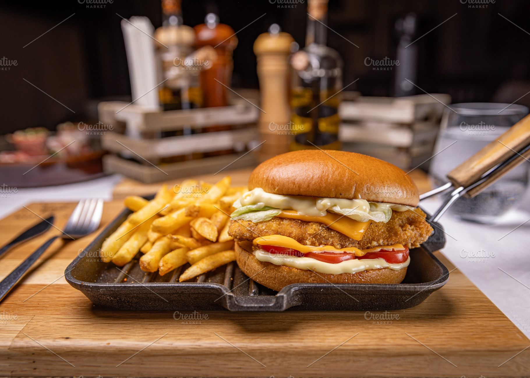 Tasty hamburger with breaded chicken, a Photo by Grafvision photography