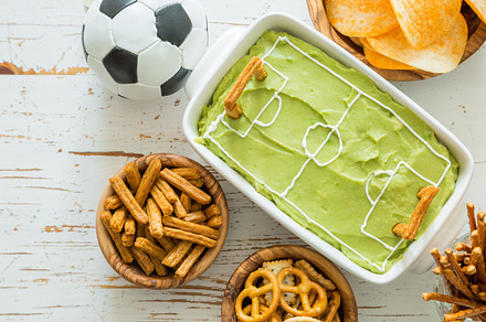 Selection of party food for watching football championship featuring euro, a Food & Drink Photo by NaumenkoOS