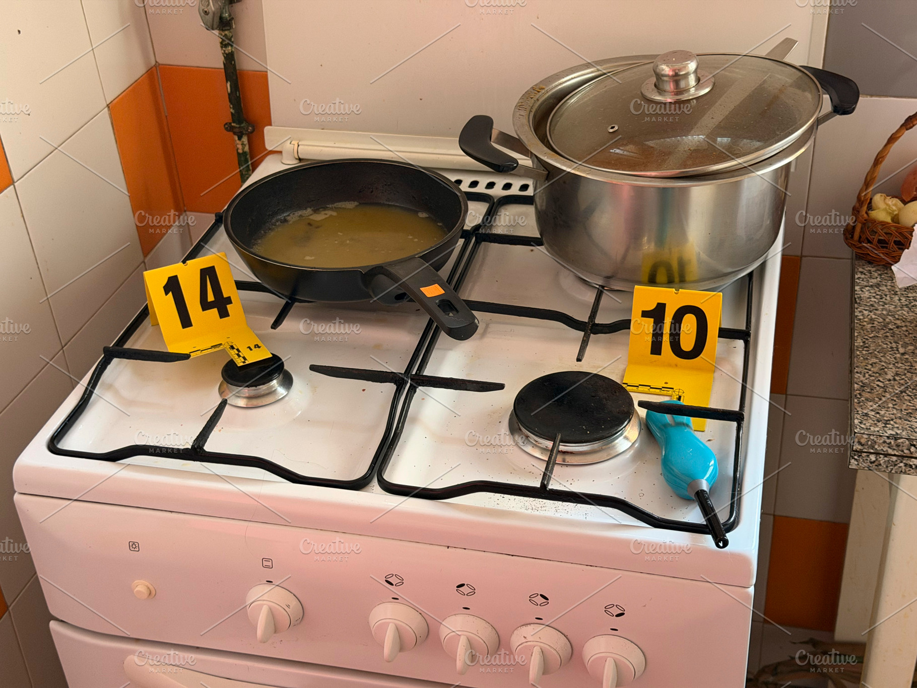 Kitchen crime scene investigation with numbered evidence markers, an Industrial Photo by karrastock