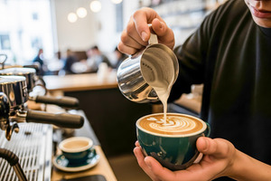 barista pouring cappuccino, a Photo by rarrarorro