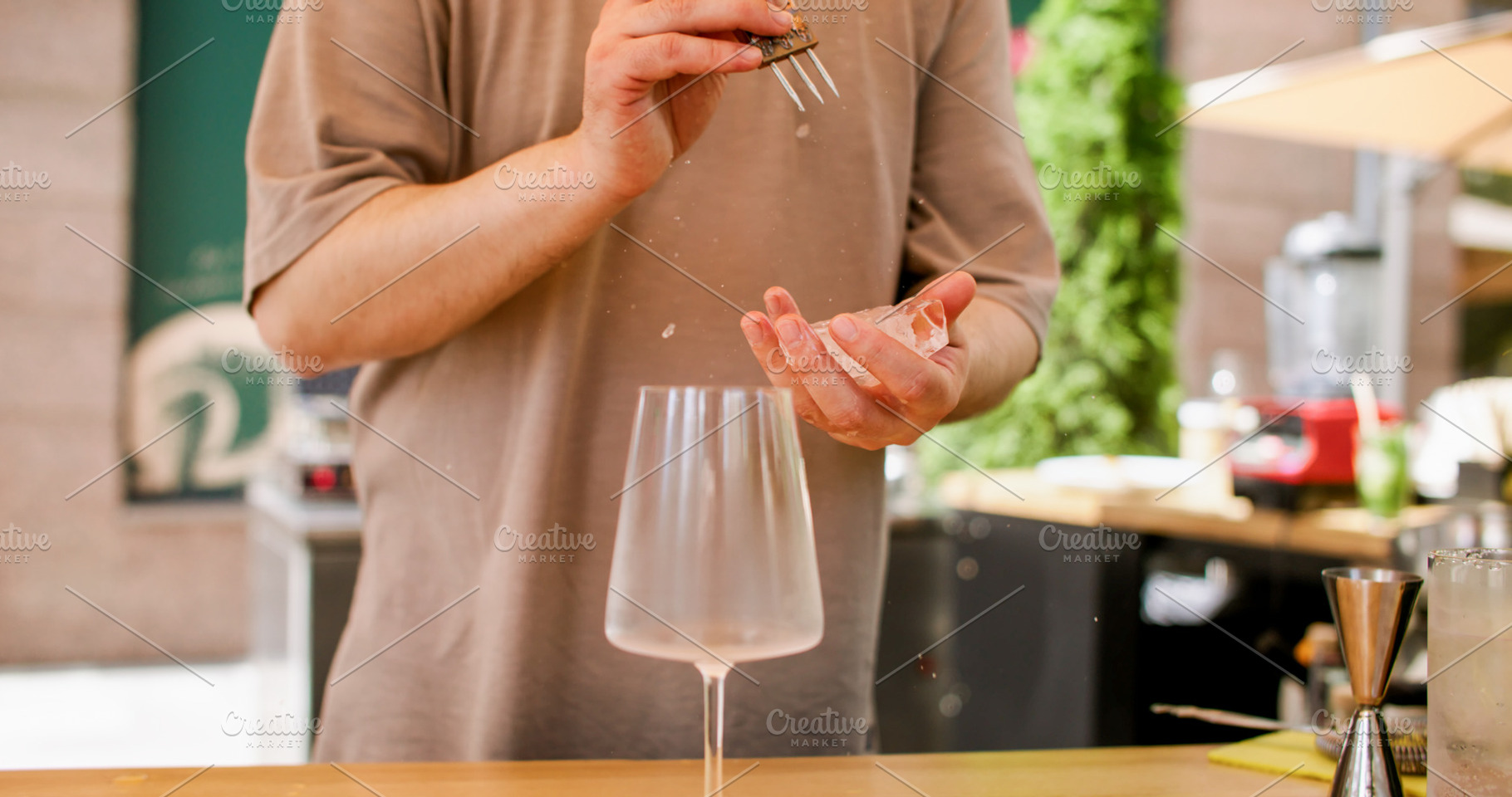 Crushing ice bartender occupation hand glass drink, a Food & Drink Photo by Photo Drive Studio