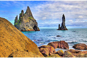 Reynisdrangar basalt sea stacks in iceland featuring reynisdrangar, iceland, a Nature Photo by Leonid Andronov