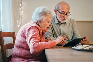 Senior man and woman making, a Technology Photo by HalfPoint