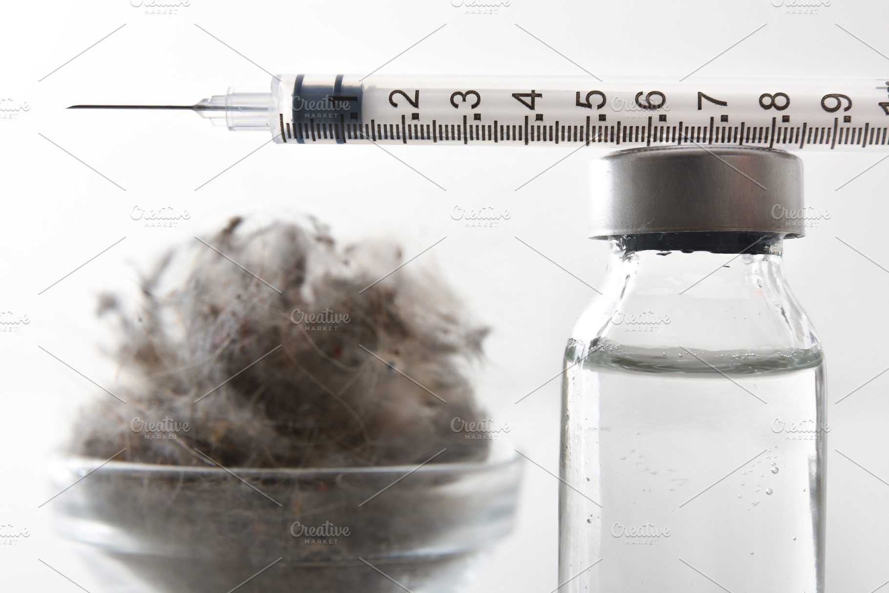 Detail of syringe on vial to treat dust allergies, a Health & Medical Photo by Davizro's Market